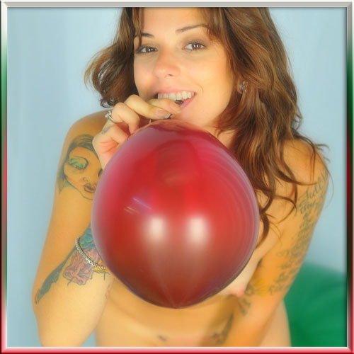 slim tattoo girl blowing big balloon